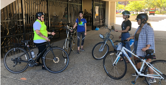 Cyclists attending a biking safety course at the Bike Cave. 
