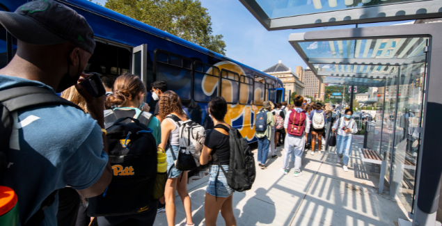 Pitt students boarding a University Shuttle.