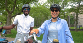 Two Healthy Ride users smiling for the camera. 
