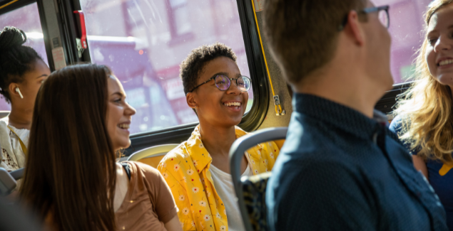 Students conversing on Pittsburgh Port Authority bus. 